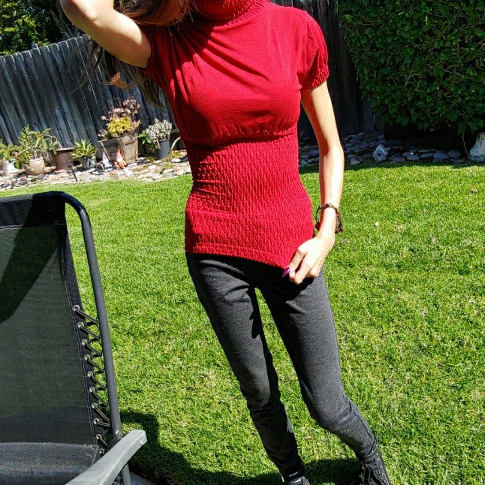 Turtleneck, short ruched sleeve blouse.